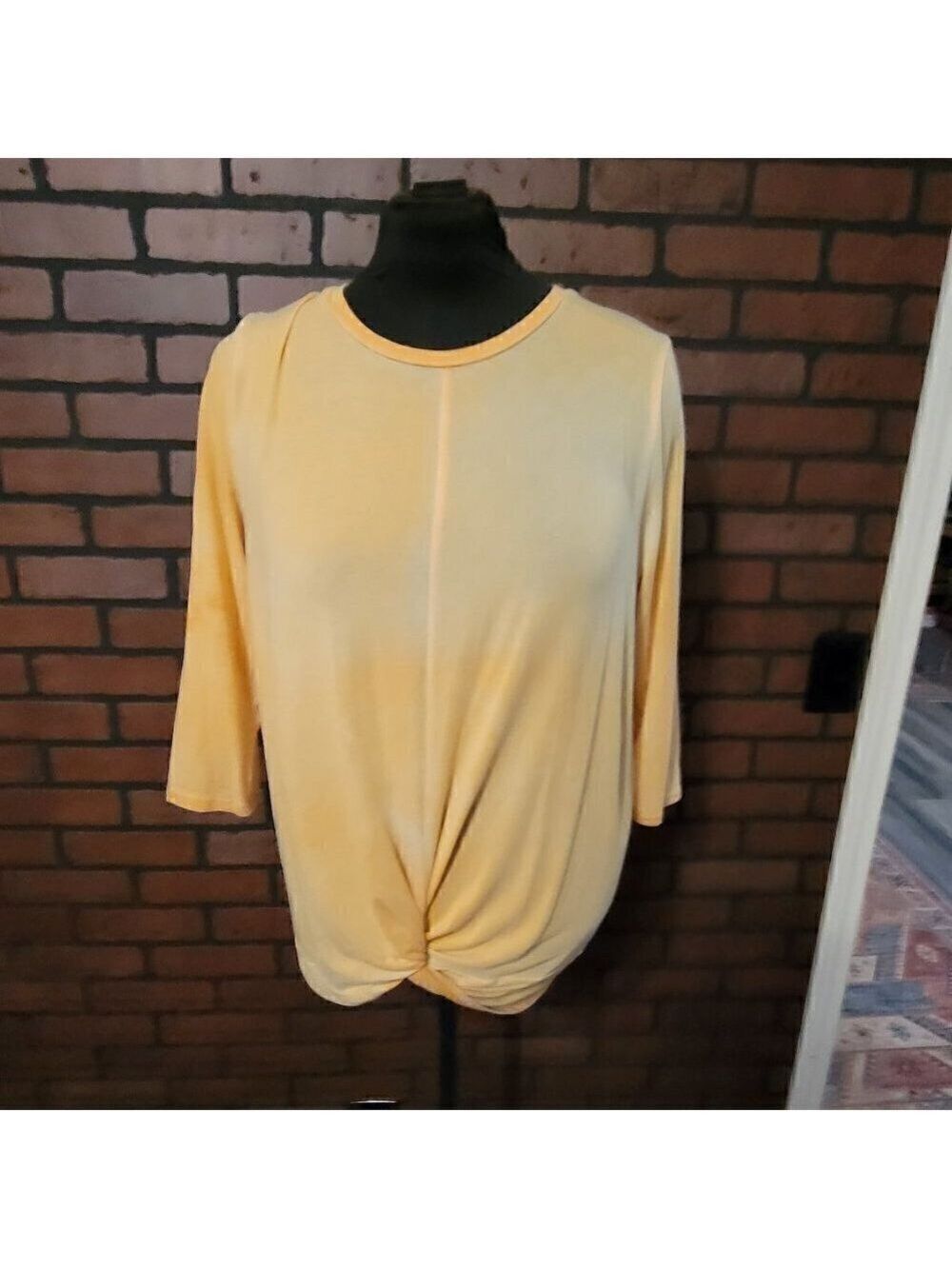 Heart w/Hips front knot top with three quarter length sleeves.